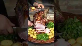 Large Roasted Camel on Traditional Platter | Juicy Meat Carving with Potatoes & Herbs