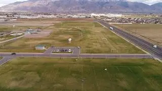Control Line Airplane Aerobatic Stunt Flight Viewed From Overhead Drone bw