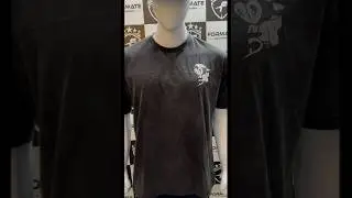 An acid wash Tshirt has a cool , faded look created by a special washing process.