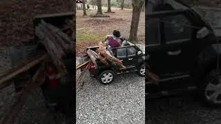 Kid working hard: Cutting and hauling wood.