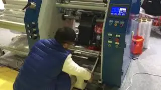 Fully automatic stretch film rewinding machine