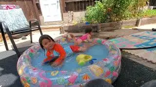 Toddlers' Summer Water Play in Backyard Inflatable Pool