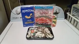 Making pasta with crabmeat & mushrooms.