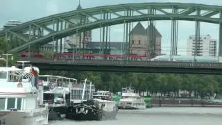 German trains crossing the Rhine on the Hohenzollern Bridge at Cologne, Germany