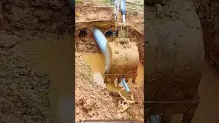 Excavator to support underground water pipe installation