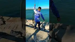 He catch big fish than he free the fish in river