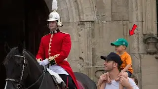 A lovely moment a kid makes the kings guard smile
