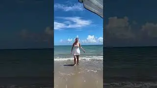 Romantic Beach Celebration: Joyful Couple Embracing by the Ocean#BeachRomance