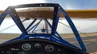 Tiny Stearman Super Baby Great Lakes biplane - departing after Army Blackhawk helicopter
