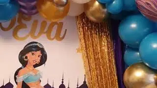 Aladdin and Jasmine Birthday party decorations with organic balloon arch and personalised banner.