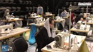 Iranian volunteers turn theater hall into mask factory amid COVID-19 pandemic