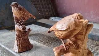 Power carving in miniature. Working on a little life-size Robin with chainsaws and other power tools