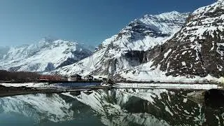 Snow Capped Mountains with pure reflection over lake In Himalayas India (Aerial) | Stock Video