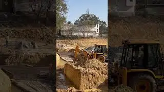 JCB at work at pond redevelopment