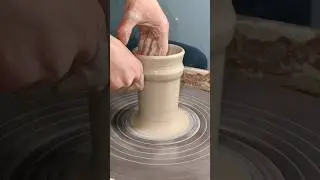 throwing a tall tumbler out of porcelain