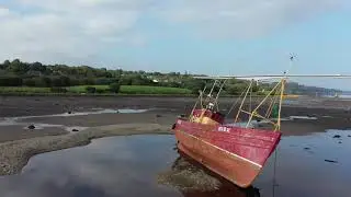 Day Dawn is a boat that is currently beached at the side of the River Foyle in Derry