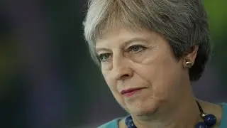 UK PM May faces defections over Brexit plan