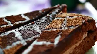 Sliced Tasty Chocolate Cake on Table Background Stock Footage