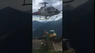 Amazing helicopter concrete delivery by helicopter up a mountain construction building project
