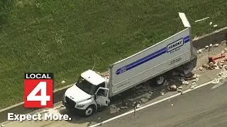 Aerial footage of I-94 after semi truck crashes into bridge, spills dressing all over