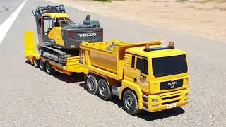 RC MAN TGA dump truck, Kane low-loader trailer, and RC Volvo excavator