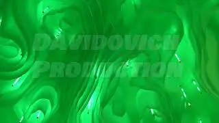 Green abstract light installation forming organic cave-like shapes for an exhibition
