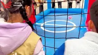 Look at the kids gathered around the inflatable arena 😍 so adorable!  
