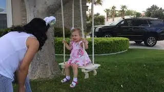 Elena Jean swinging in a dress