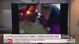 Bodycam video shows Cleveland police rescue family from burning home