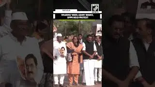 Congress MPs stage protest outside Parliament wearing Modi-Adani masks; TMC, SP absent