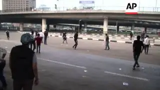 Revolutionary activists clash with supporters of military-backed government