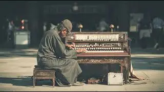 a man is using harmonium in japan