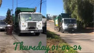 2 Waste Management Garbage trucks collecting on post New Years trash in HighGrove!