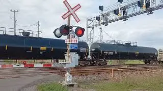 CN mixed freight with brand new SD75iacc converted loco also a ET44AC and gevo leading past 