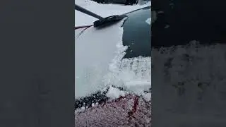 Guy Brushes Snow Off Car With Broom