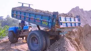 Sand is load from the river into tractors unload over rough roads through hydraulic facilities syste