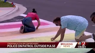 Police on patrol outside Pulse memorial as protesters recolor crosswalk