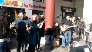 Students play street music for charity.