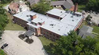 Spray Foam Roof over Gravel Built-up - Landmark Recovery
