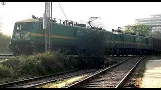INDIAN RAILWAYS Gomoh WAG9 pulls its Tughlakabad sibling past Plasser factory in Faridabad