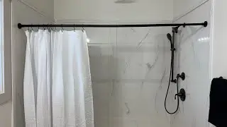 This is a great shower curtain rod that stays in place