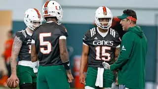 Canes offensive coordinator Dan Enos instructs Hurricanes quarterbacks