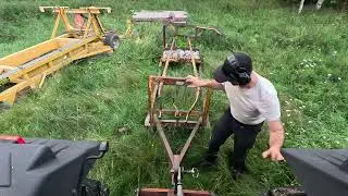 Road maintenance with MF 372 and tow behind grader