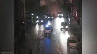 CCTV shows the moment two shots were fired at marked police car