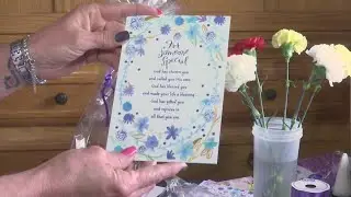 Woman collecting donations  to give Mother's Day baskets for nursing home seniors