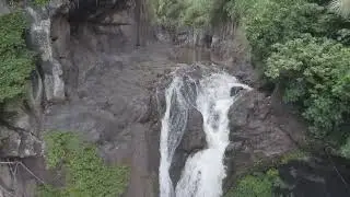 Maui's Untamed Beauty: Rocky Forest and River Falls.