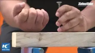Stunning: Chinese master hammers nail into wood with back of hand