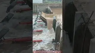 Lowering a Hydraulic Dam Gate to Release Water