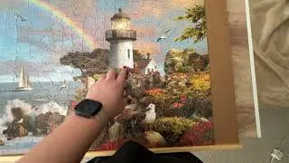 Lighthouse rainbow cliffside jigsaw puzzle