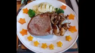 Beef medallion steak 21 days matured,served with mushrooms and onions